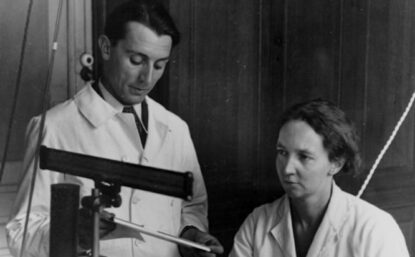 old photograph of two people in a lab