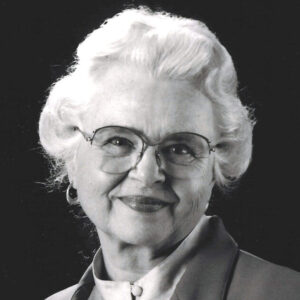 black and white photo of an older woman wearing glasses