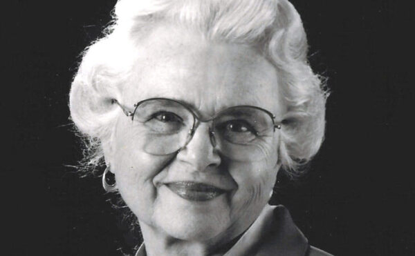 black and white photo of an older woman wearing glasses