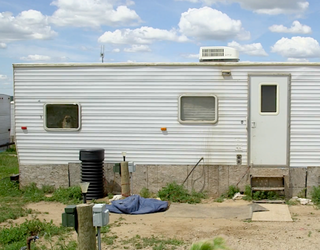 view of the side of a white trailer