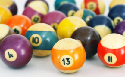 Color photo of old billiard balls on white background