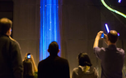 crowd looking at light exhibit