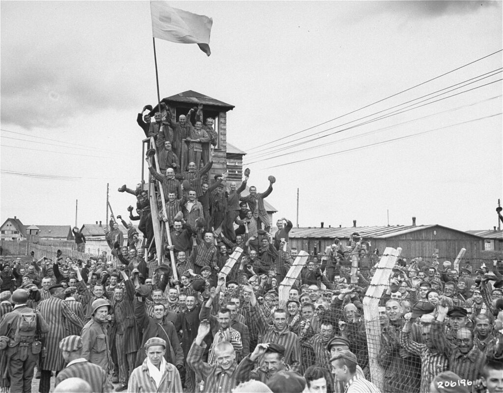 Photo of concentration camp survivors cheering