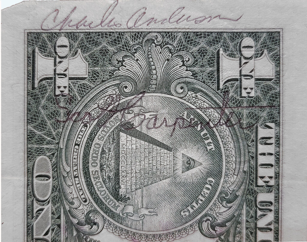 Photo of dollar bill with signatures