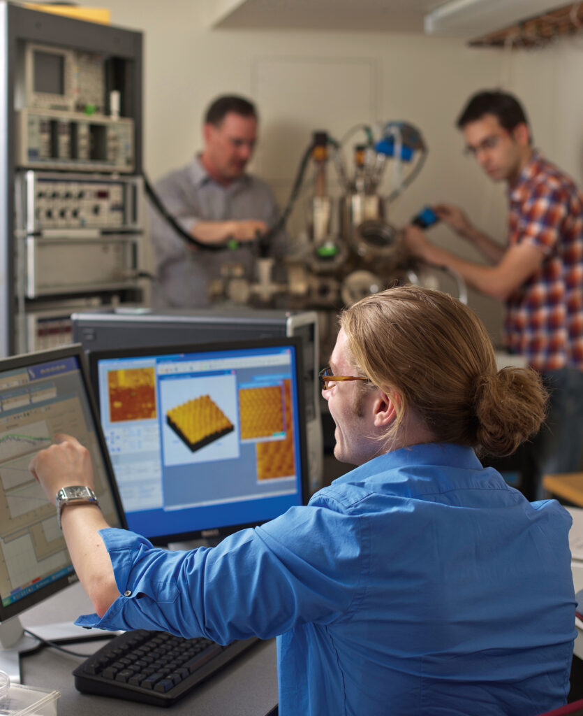 Photograph of people in a high-tech lab