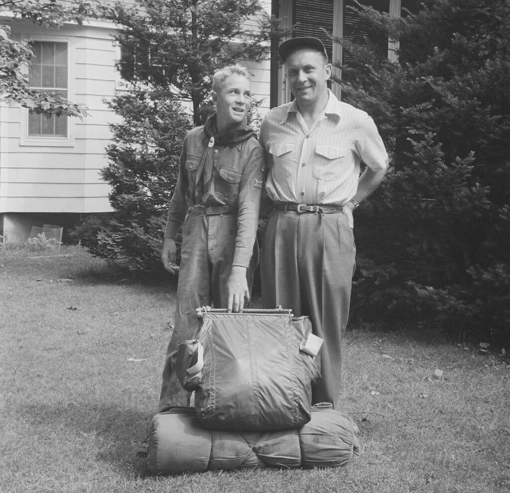 Photo of a father and son in a yard