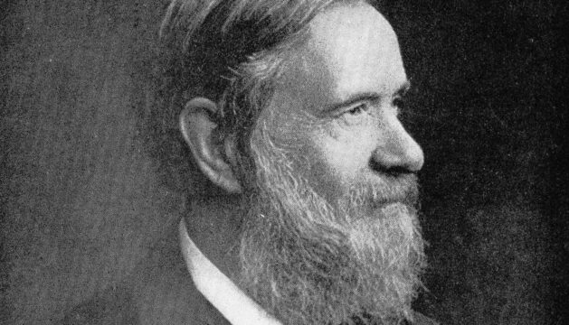 Stanislao Cannizzaro looking to the side, seated and wearing a suit with a bow tie.