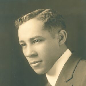 Professional portrait of E. M. A. Chandler, ca. 1930. He looks over his left shoulder and is wearing a suit.