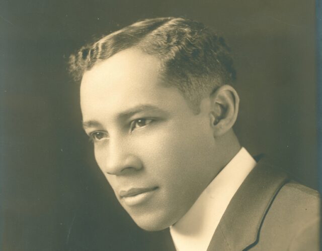 Professional portrait of E. M. A. Chandler, ca. 1930. He looks over his left shoulder and is wearing a suit.