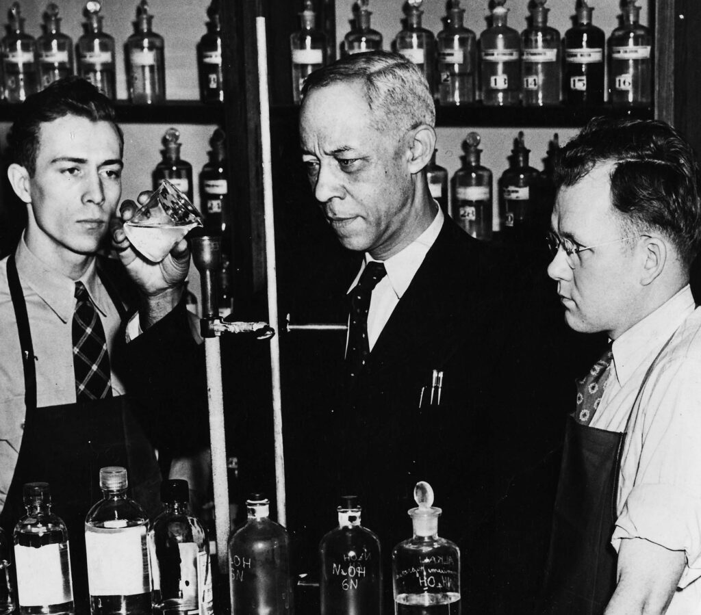 Edward Chandler (center) teaching chemistry at Roosevelt University, ca. late 1940s or early 1950s.