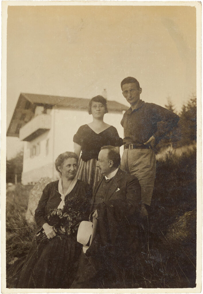 Family portrait standing outdoors hillside