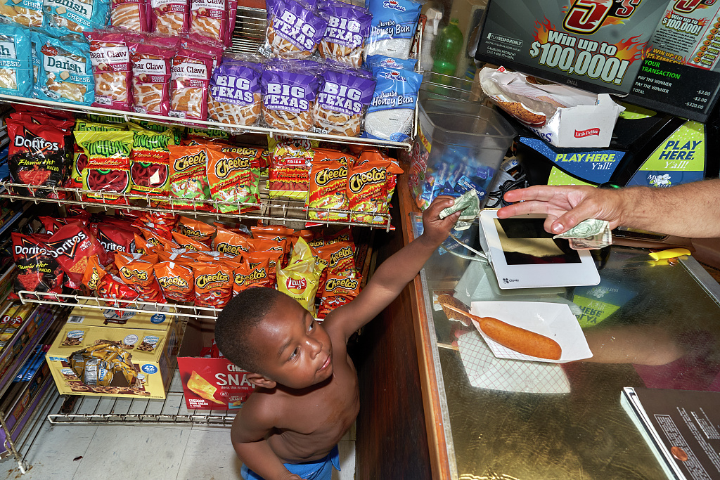 Color photo of a young boy in convenience store