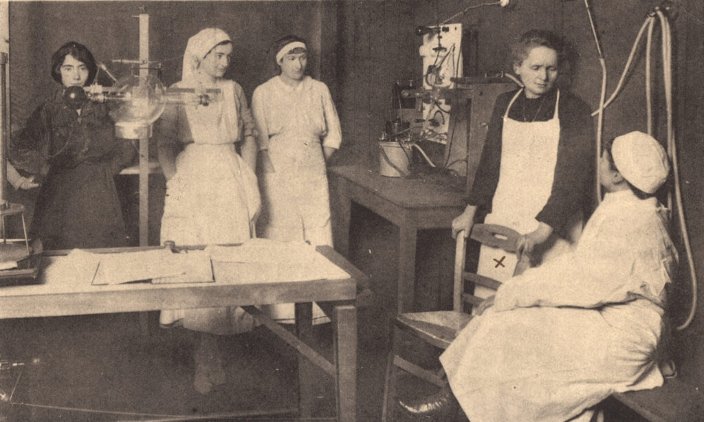 Curie in radiography suite with a group of student nurses