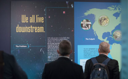 people looking at an exhibit