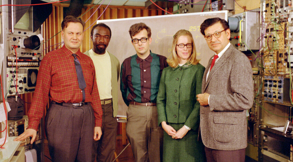 color photo of five posed in a lab