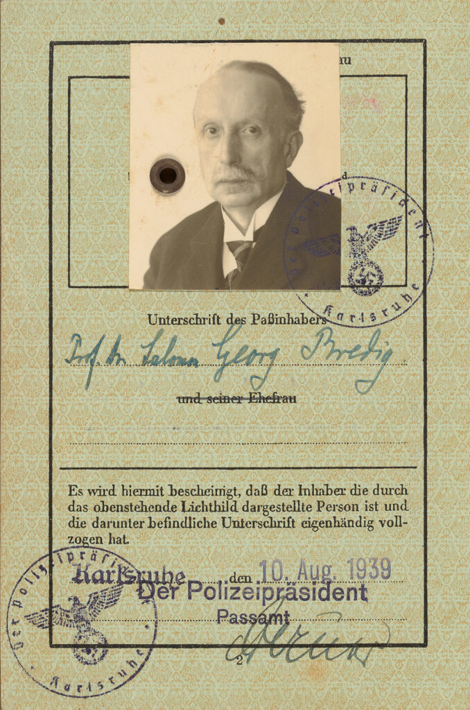 Photograph of an old passport with photo
