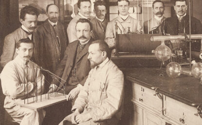 Group of men in old chemistry lab