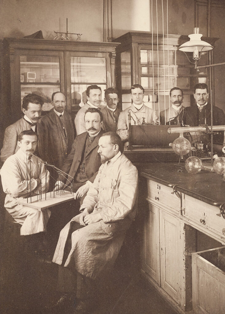 Group of men in old chemistry lab