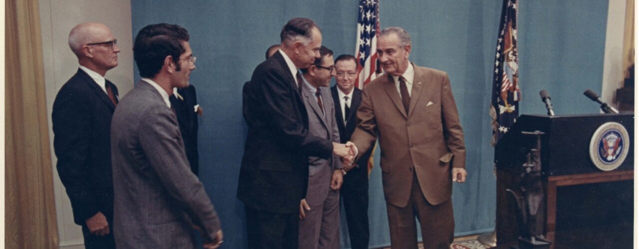 Glenn Seaborg shaking hands with Lyndon B. Johnson