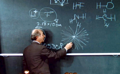 teacher at chalkboard
