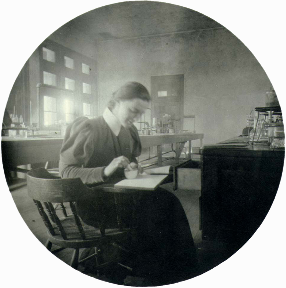 Circular photo of young woman in lab