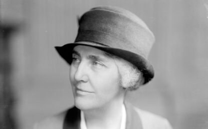 Black and white photo portrait of woman in uniform