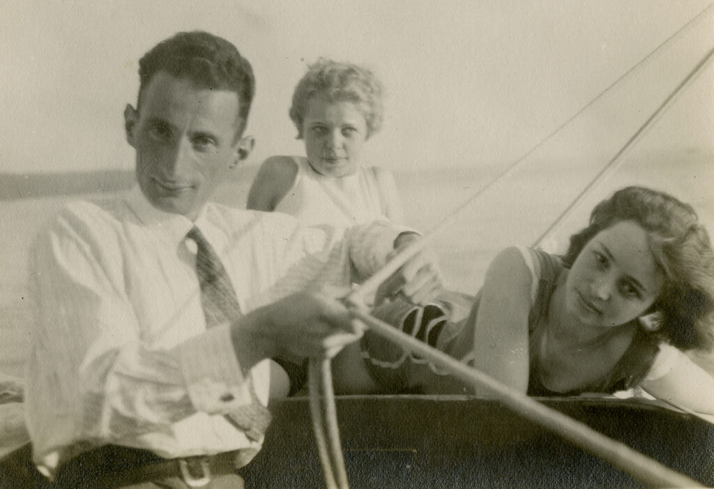 Photograph of young people on a sailboat