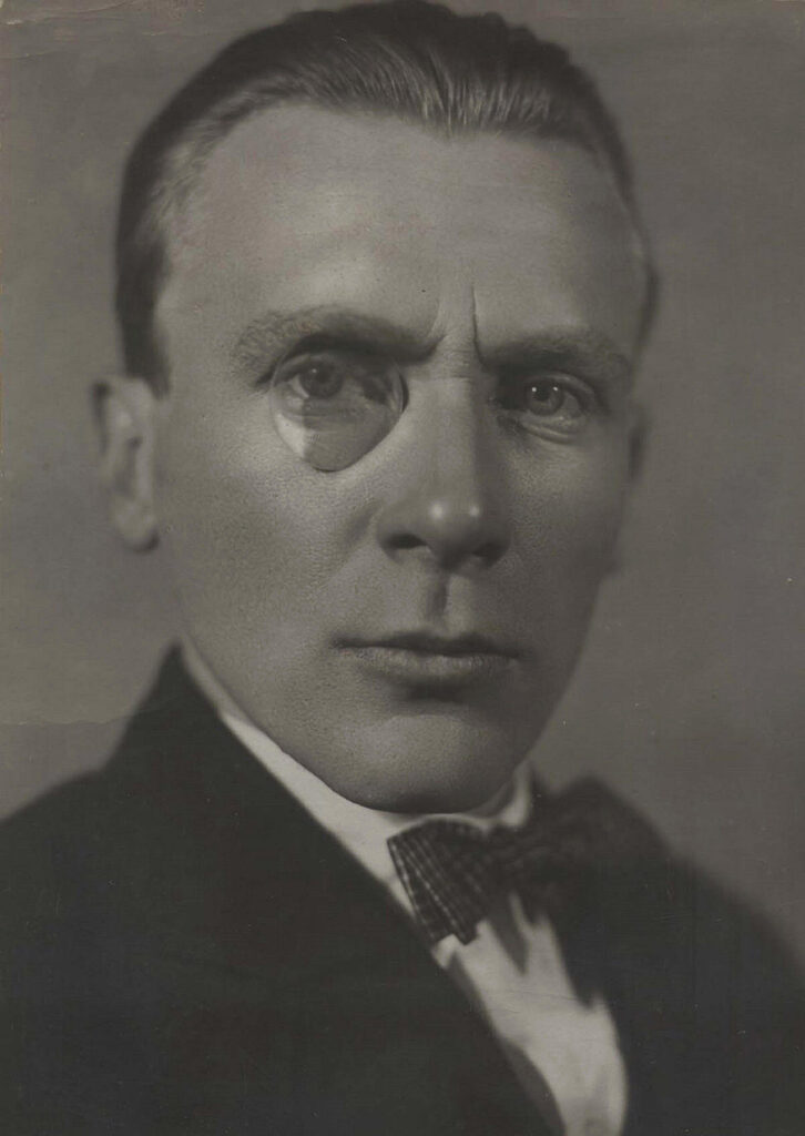 Portrait of Bulgakov with monocle and slicked hair
