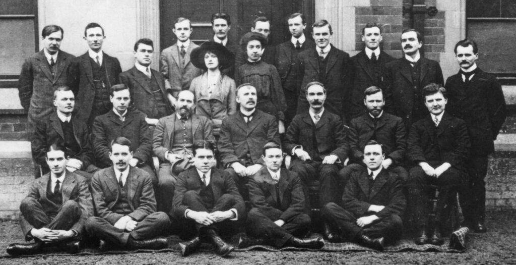 black and white photo of group of men and women