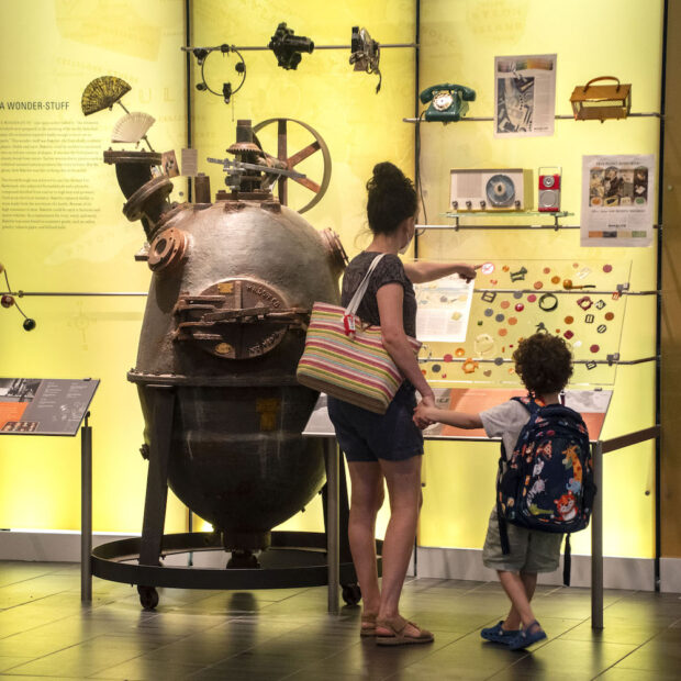 woman and child in front of a museum exhibit