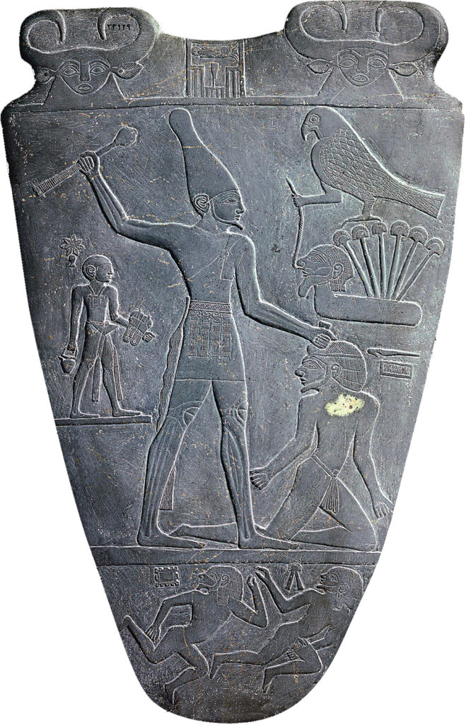 Gray, engraved, shield-shaped stone