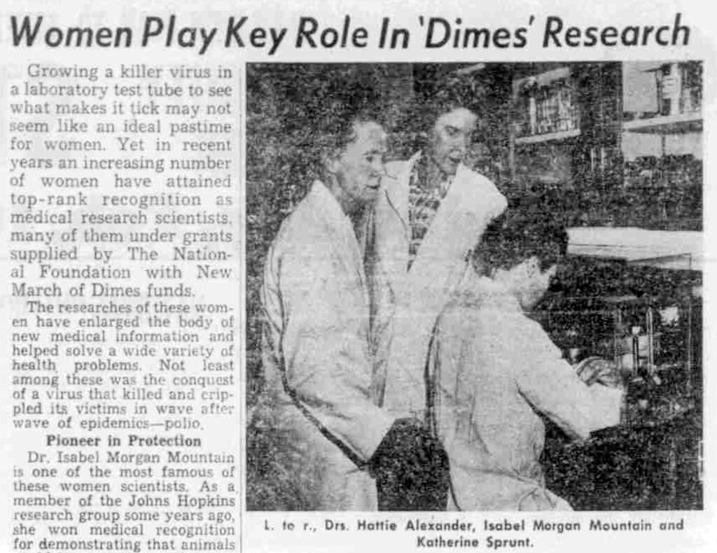 Old newspaper clipping with photo of three women in a lab