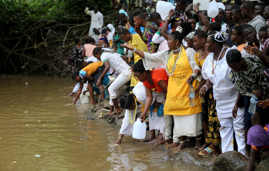 Crowd of people by a river