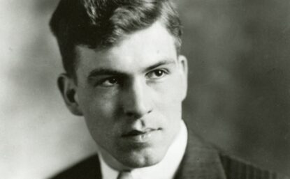 A professional portrait of Donald Othmer as a young man, wearing a suit and tie.