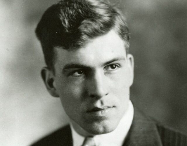 A professional portrait of Donald Othmer as a young man, wearing a suit and tie.