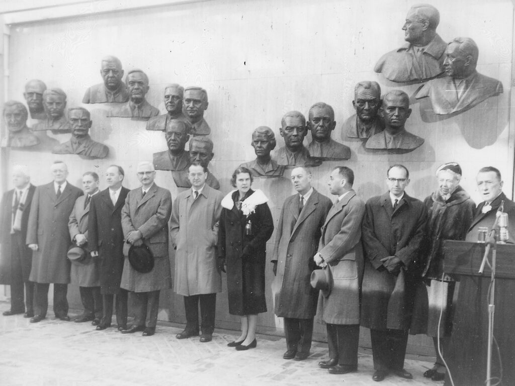 Black and white photo of a group of people standing