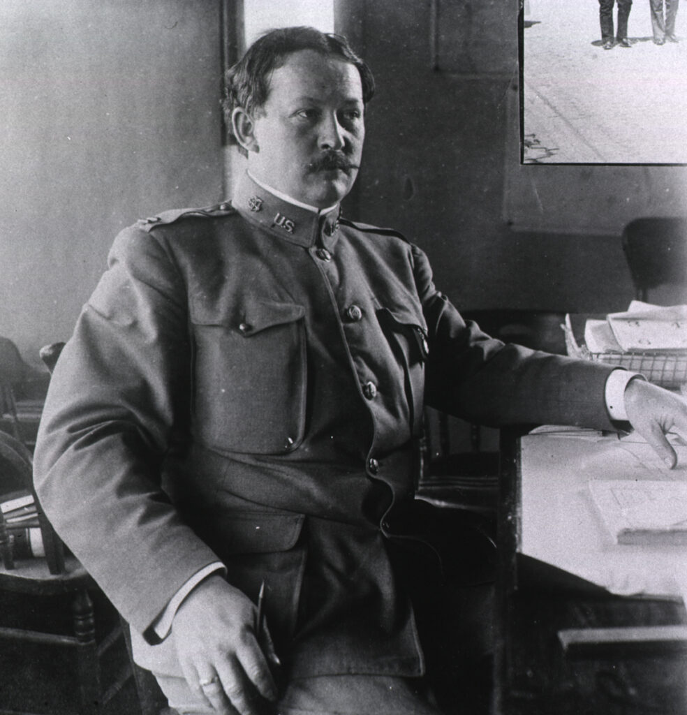 Photo of mustachioed white man in uniform