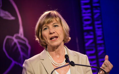 Photograph of Sue Desmond-Hellman speaking on stage.