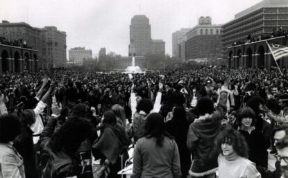 large crowd outside in city