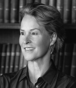 Frances Arnold in black and white in front of books