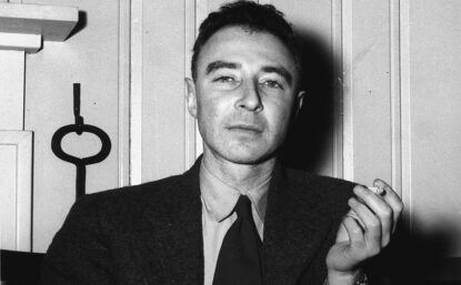 portrait of Robert Oppenheimer sitting down smoking