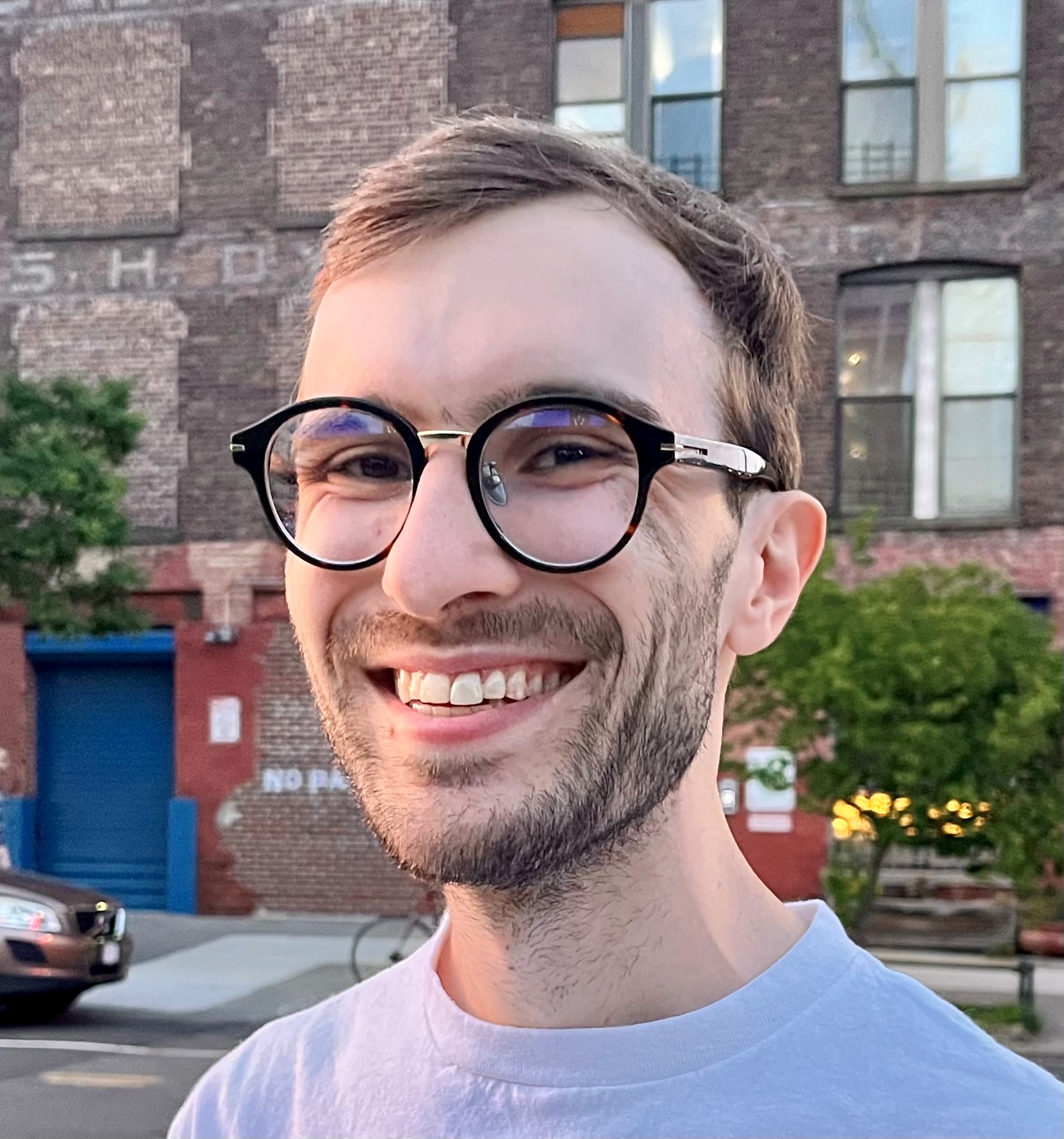 Emmet von Stackelberg smiling wearing glasses