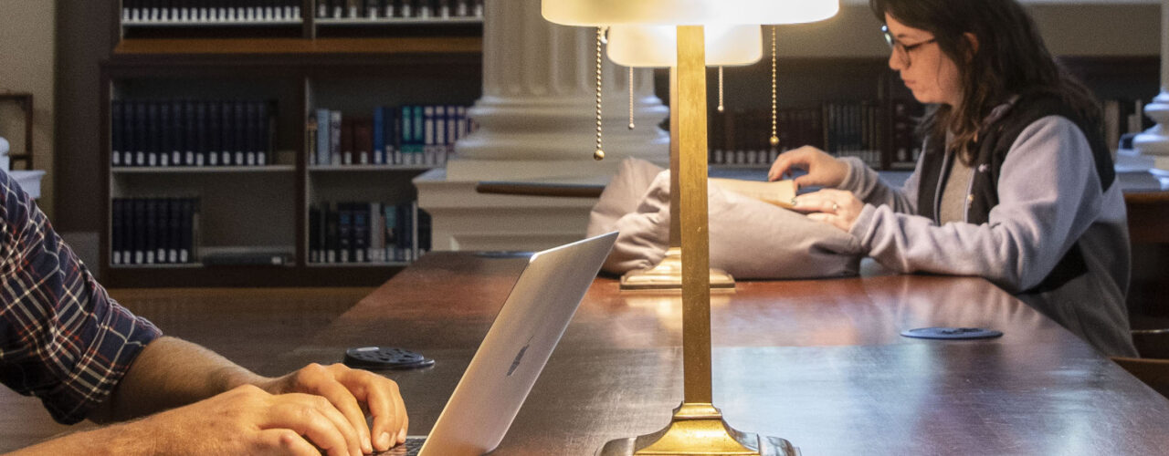 scholars doing research in a library