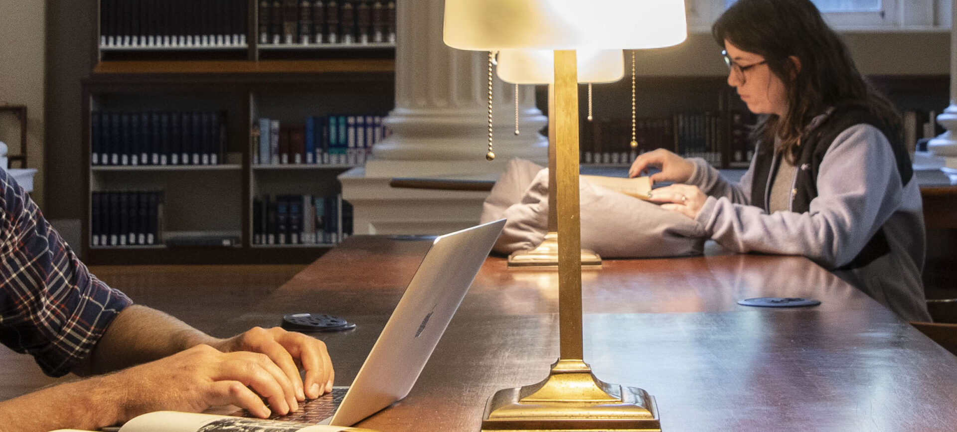scholars doing research in a library