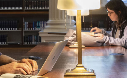 scholars doing research in a library