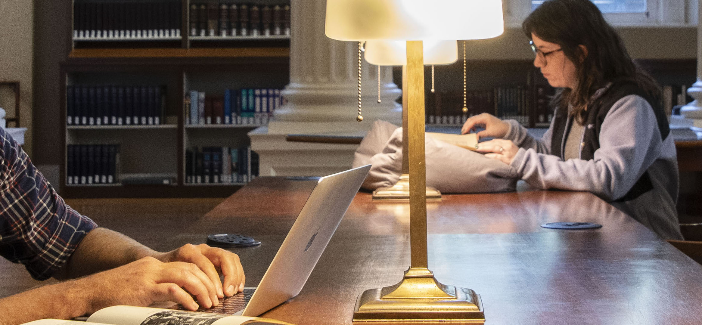 scholars doing research in a library