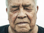 Close-up portrait of an older man with his eyes closed