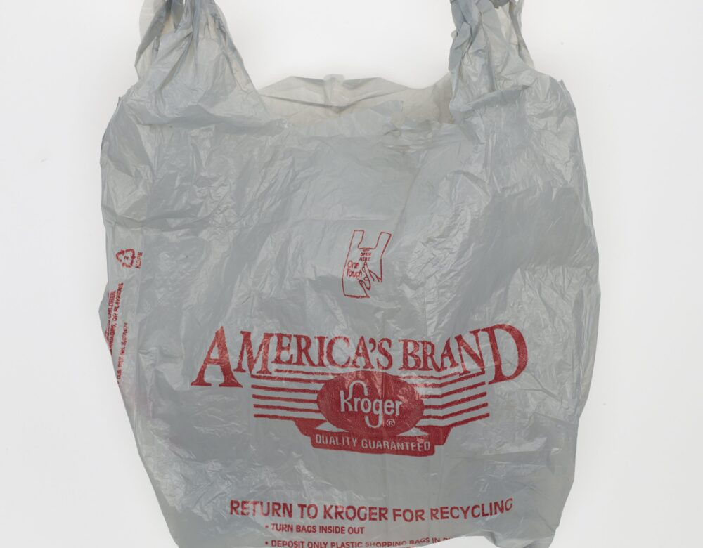 wrinkled white grocery store plastic bag with red lettering