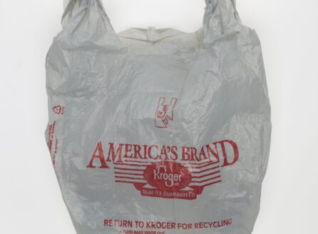 wrinkled white grocery store plastic bag with red lettering