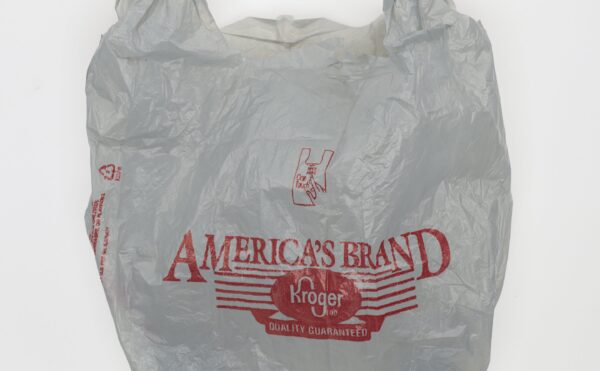 wrinkled white grocery store plastic bag with red lettering
